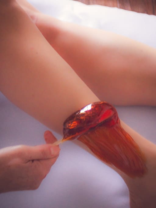 All Natural Waxing a Woman's Leg at Sonia's Waxing Plus
